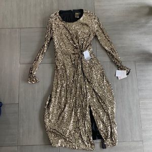 NWT size 6 Gold sequin knee length dress with long sleeve.